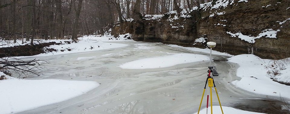 A surveying laser on ice in the Vermillion River during a Vector survey.